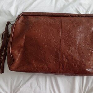 Vintage genuine leather brown clutch with tassel made in Columbia.